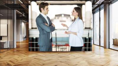 team of successful business people. two businessmen resting and talking in the office. man and woman informan meeting of the business center. Wall mural